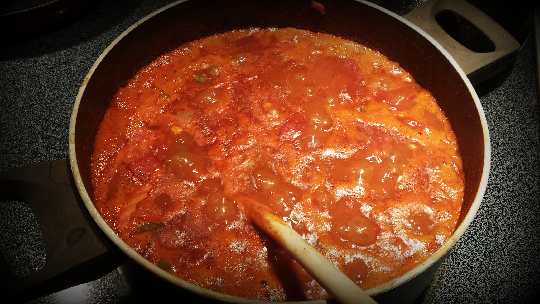 Simmering pot of food on stove