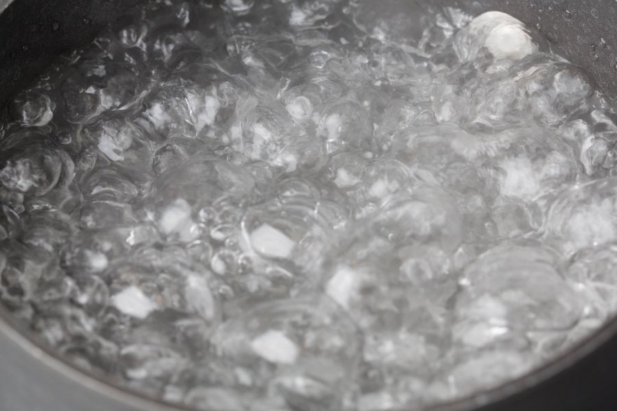 Pan with boiling water on stove