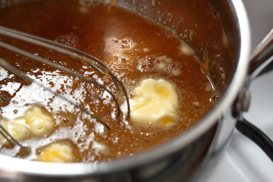 Stirring simmered food in a pot