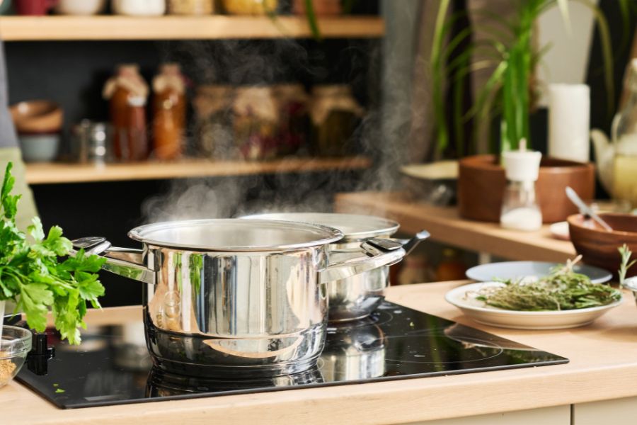 Simmering food in a saucepan on electric stove