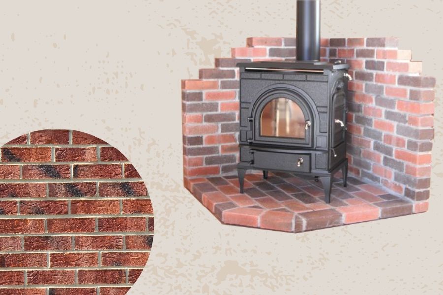 Corner wood stove sits on the brick hearth