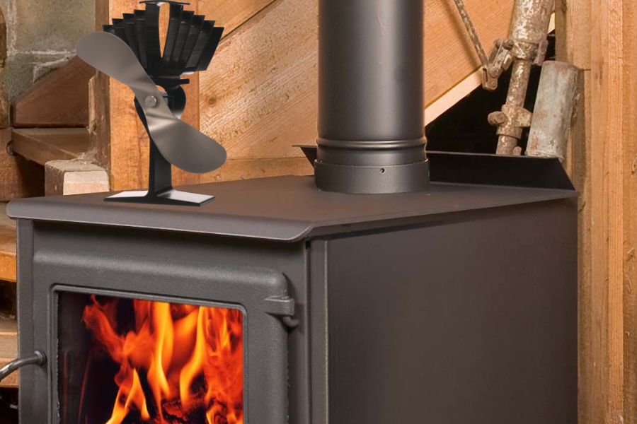 A heat-powered fan on burning wood stove