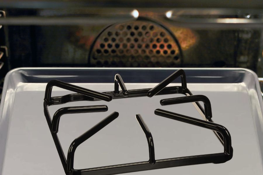 Heating the oiled stove grate in oven