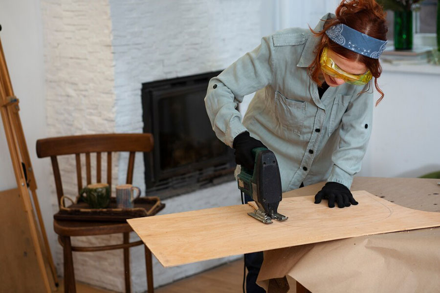 woman building a frame for fireplace