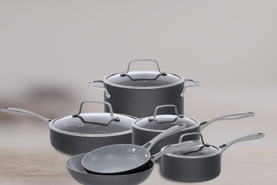 Set of ceramic cookware on table 