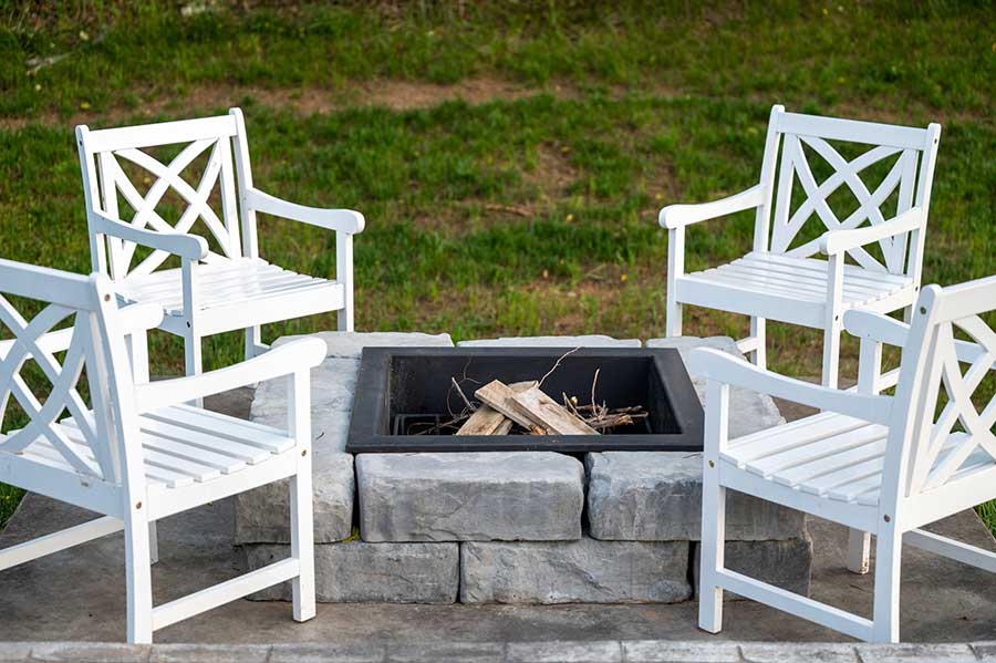 fire pit area with furniture and stone bricks