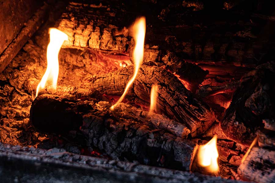 Dangers of burning wood in a gas fireplace
