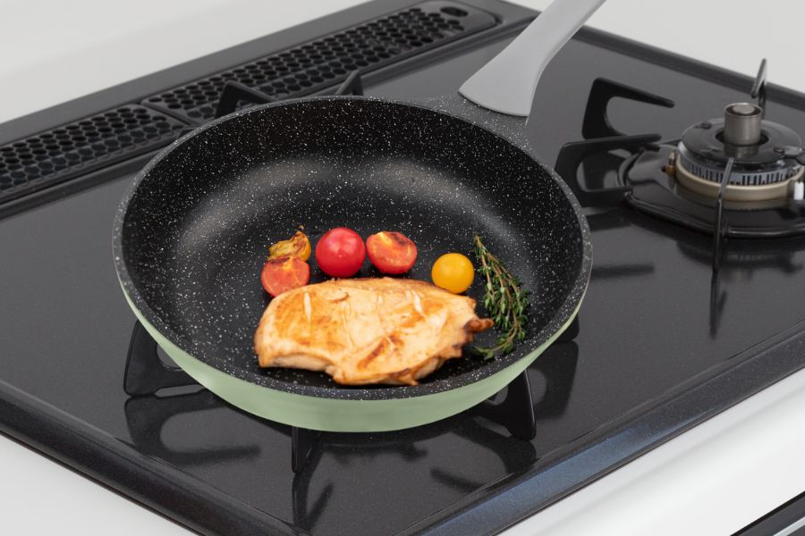 Food in granite pan on stove
