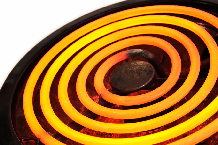 Close-up glowing electric stove burner