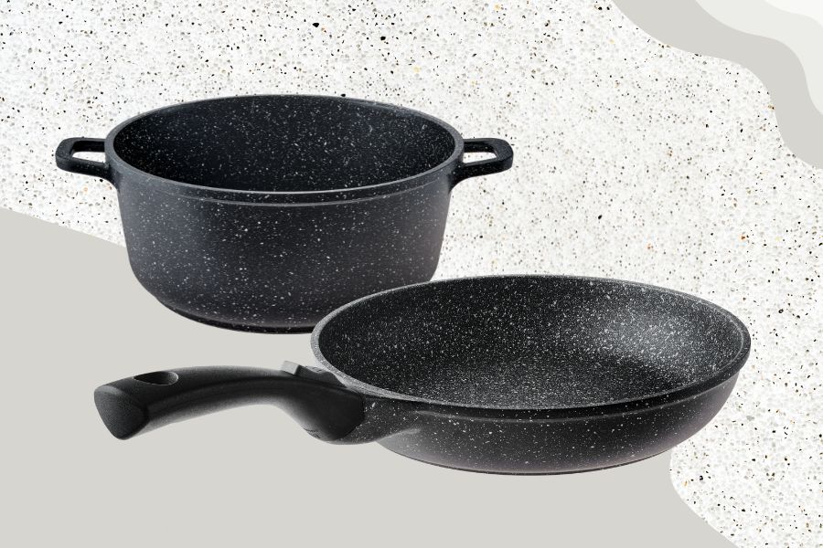 Set of granite cookware on a background with granite background