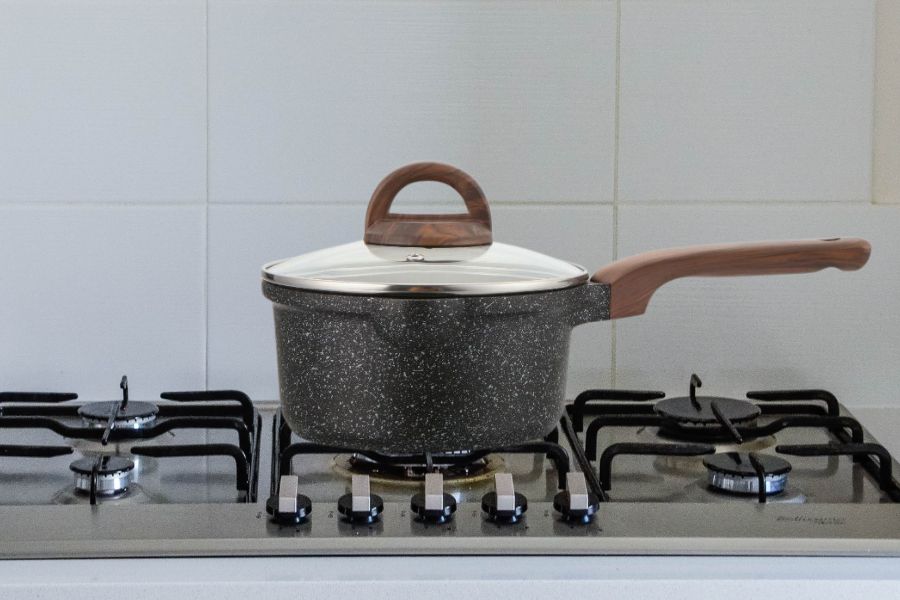 Granite saucepan on stove in the kitchen