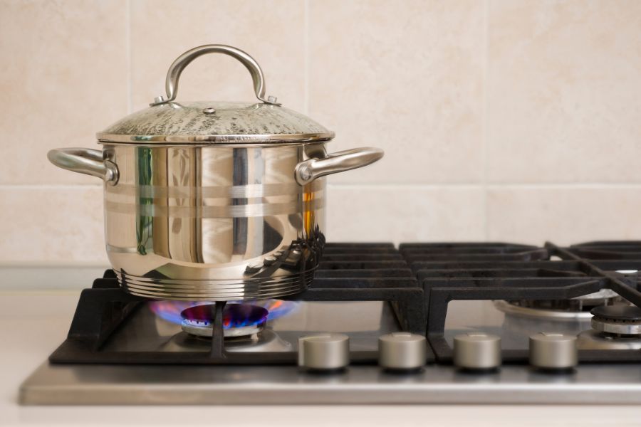 Boiling pot on gas stove in the kitchen