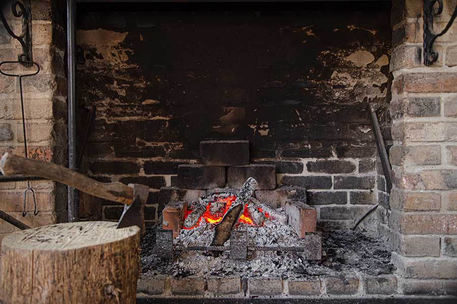 Fireplace with a burning fire, comfort and atmosphere