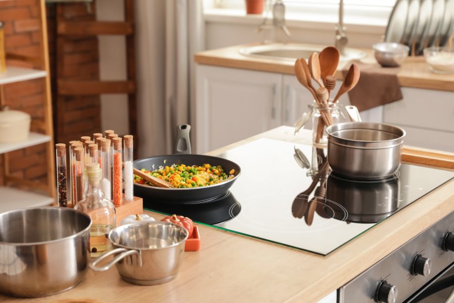 Cooking on electric stove in the kitchen