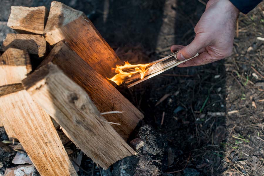 Using fire starters for easy ignition and quick wood burning