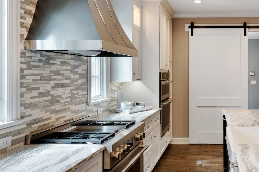 Gas stove and vent hood in the kitchen