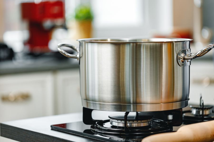 Stainless steel pot on gas stove in the kitchen