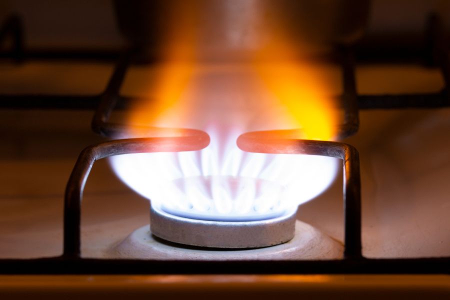 Yellow flame of gas burning from a stove