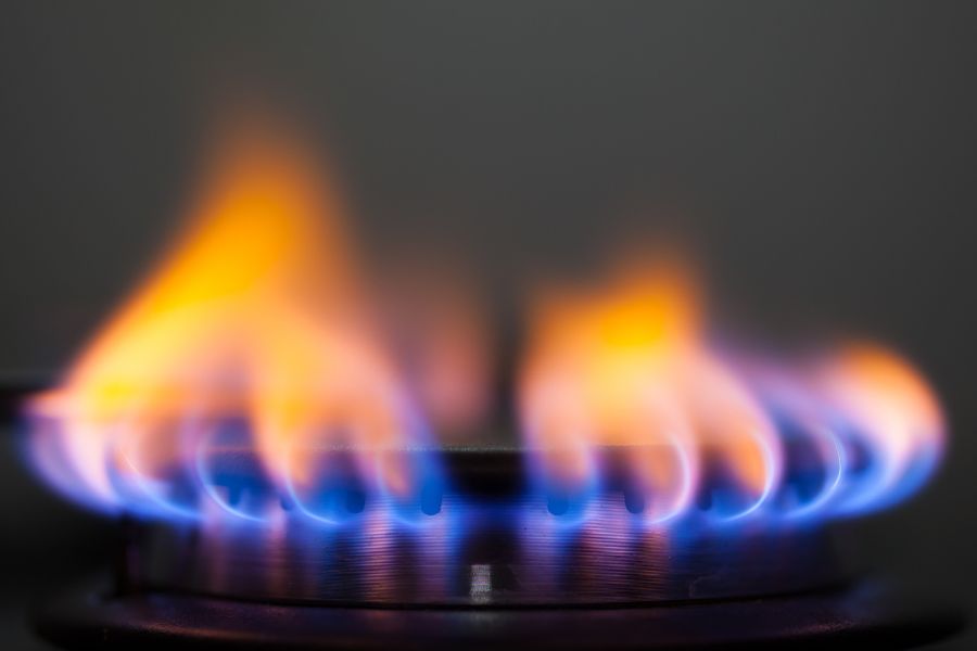 Close view of yellow flame on gas stove
